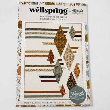 Wellspring Diamond Trail Quilt Pattern by Fancy That Design House featuring a modern diamond and strip quilt design with a finished size of 56 x 74 inches.