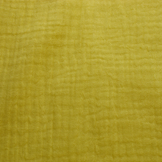 This soft double gauze cotton fabric has a light airy texture with a gently crinkled surface.
