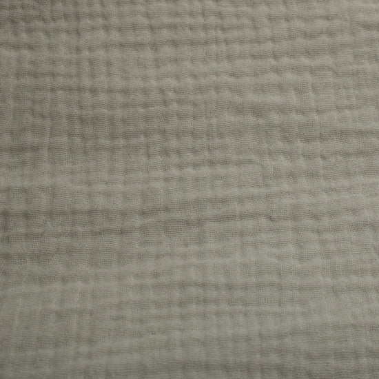 This soft double gauze cotton fabric has a light airy texture with a gently crinkled surface.