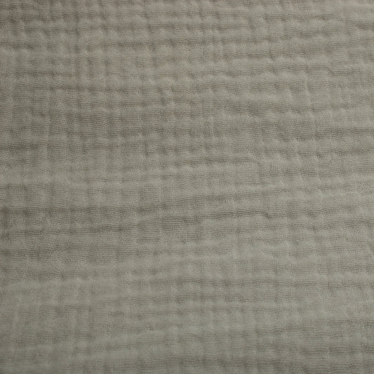 This soft double gauze cotton fabric has a light airy texture with a gently crinkled surface.