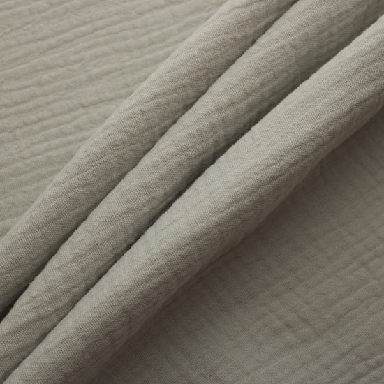Off white double gauze cotton fabric with soft crinkled texture