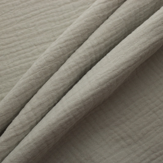 Off white double gauze cotton fabric with soft crinkled texture