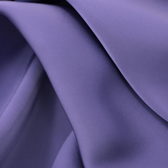 This elegant satin fabric features a smooth, refined surface with a soft sheen in a sophisticated mauve shade.