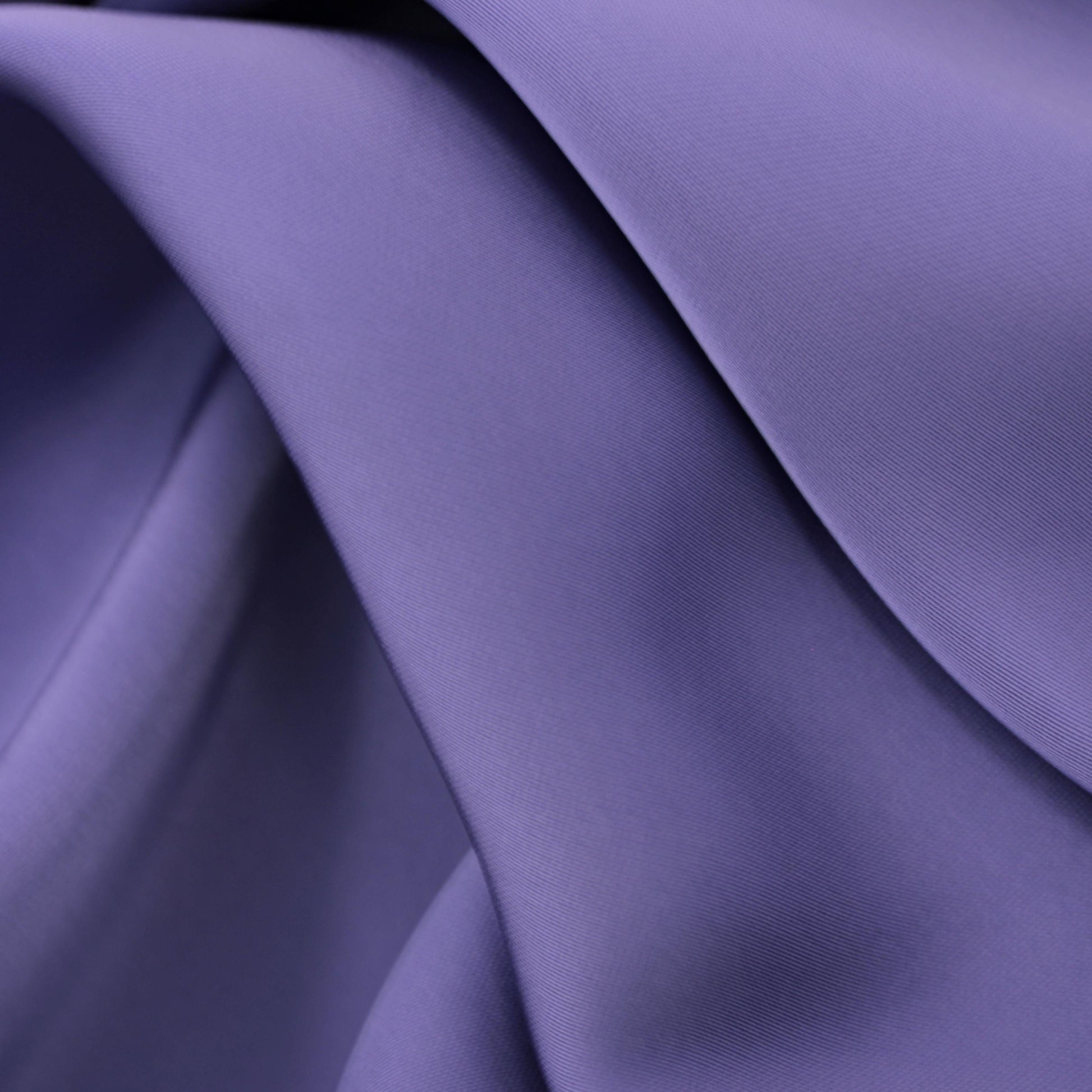 This elegant satin fabric features a smooth, refined surface with a soft sheen in a sophisticated mauve shade.