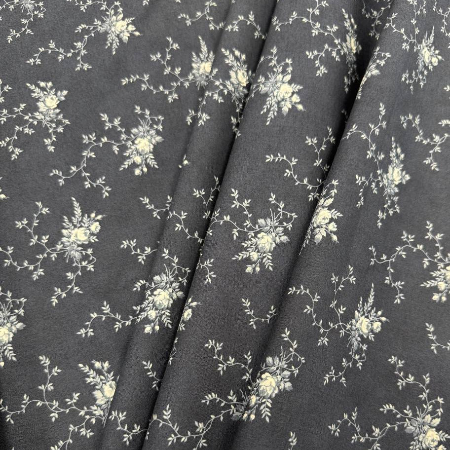 Breathtaking Blues Midnight 100% cotton fabric by 3 Sisters for Moda Fabrics featuring cream floral vine motifs on a deep blue background.