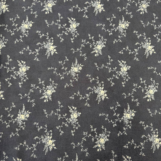 Breathtaking Blues Midnight 100% cotton fabric by 3 Sisters for Moda Fabrics featuring cream floral vine motifs on a deep blue background.
