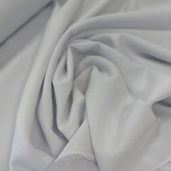 100% polyester crepe fabric, 150 cm wide, available in multiple solid colors.