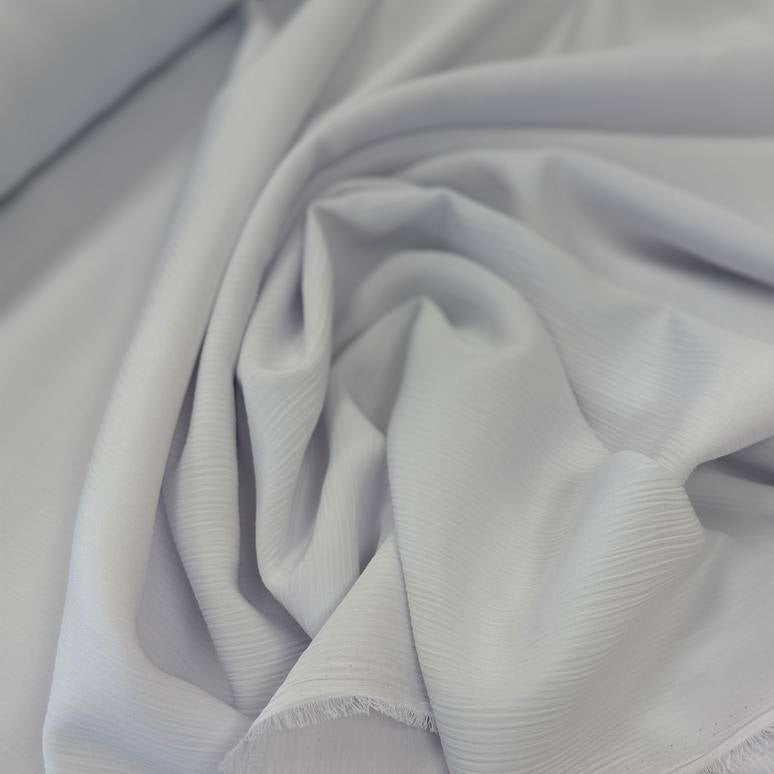 100% polyester crepe fabric, 150 cm wide, available in multiple solid colors.