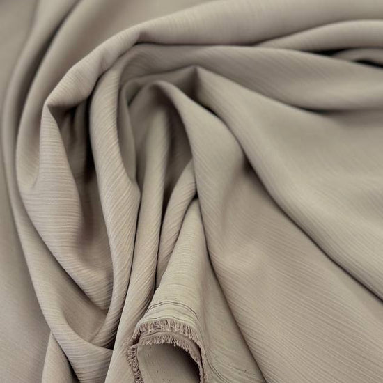 100% polyester crepe fabric, 150 cm wide, available in multiple solid colors.