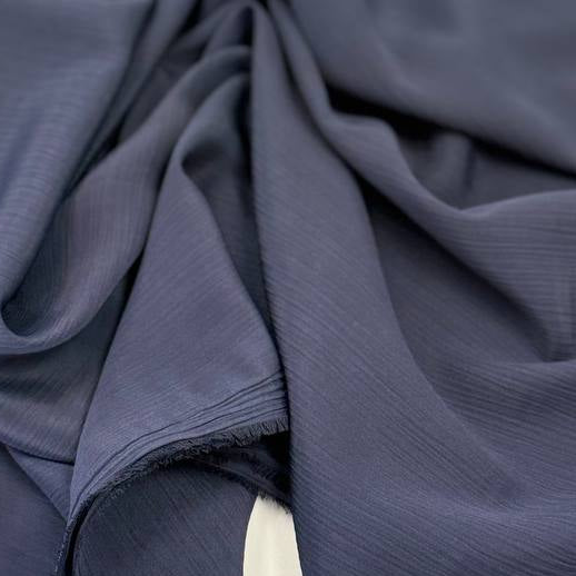 100% polyester crepe fabric, 150 cm wide, available in multiple solid colors.
