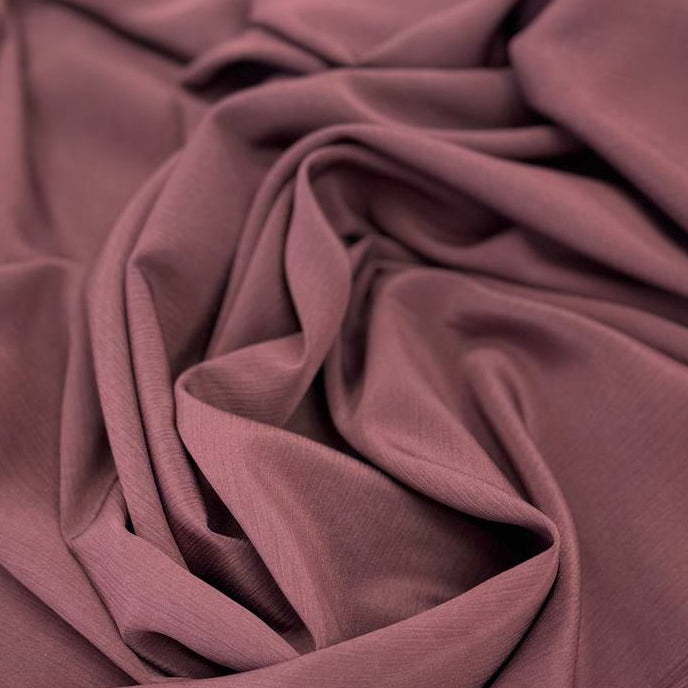 100% polyester crepe fabric, 150 cm wide, available in multiple solid colors.