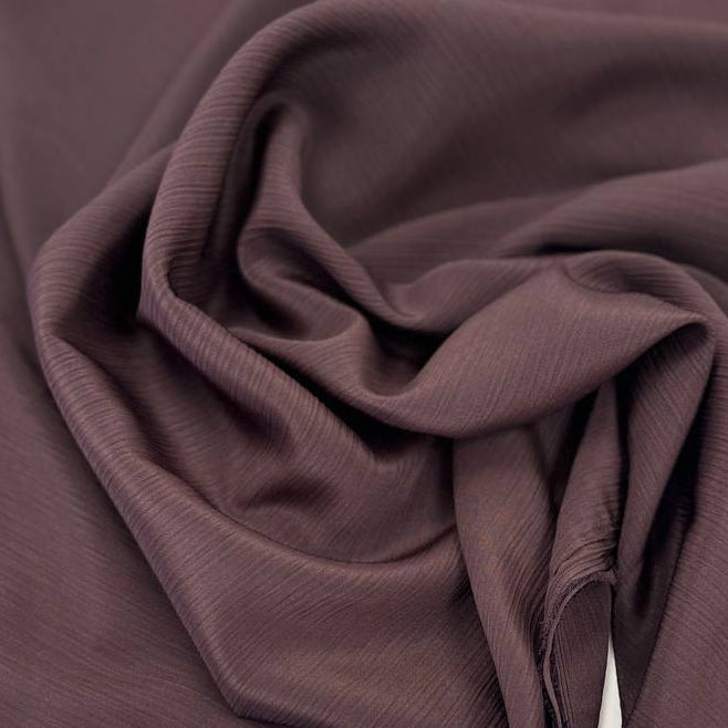 100% polyester crepe fabric, 150 cm wide, available in multiple solid colors.