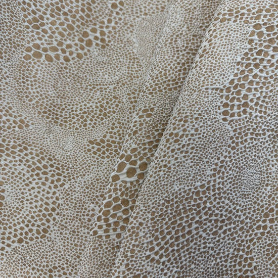 Beige and cream Cloud upholstery fabric with an organic textured pattern, suitable for pillows, cushions, furniture upholstery, and home décor.