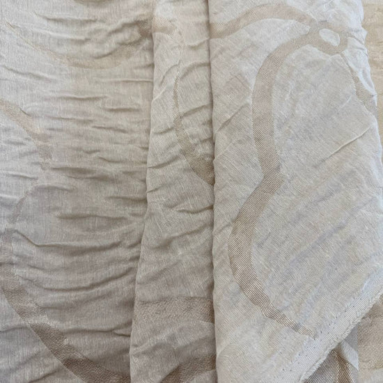 Double-sided beige and cream Cloud upholstery fabric with a textured abstract pattern and reversible design, suitable for cushions, pillows, furniture upholstery, and home décor.