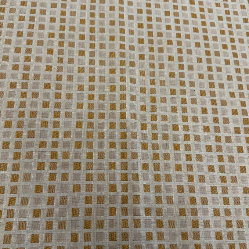 Cream and gold upholstery fabric with a small woven geometric square pattern, suitable for decorative pillows, cushions, furniture upholstery, and home décor.