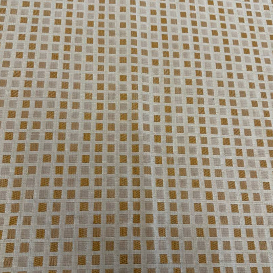 Cream and gold upholstery fabric with a small woven geometric square pattern, suitable for decorative pillows, cushions, furniture upholstery, and home décor.