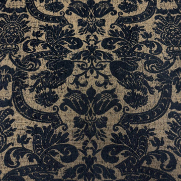 Black and beige woven upholstery fabric with an elegant floral ornamental pattern, used for handmade Sasha’s Atelier bags, cushions, upholstery, and home décor.