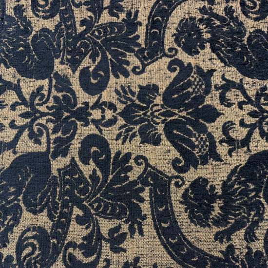 Black and beige woven upholstery fabric with an elegant floral ornamental pattern, used for handmade Sasha’s Atelier bags, cushions, upholstery, and home décor.