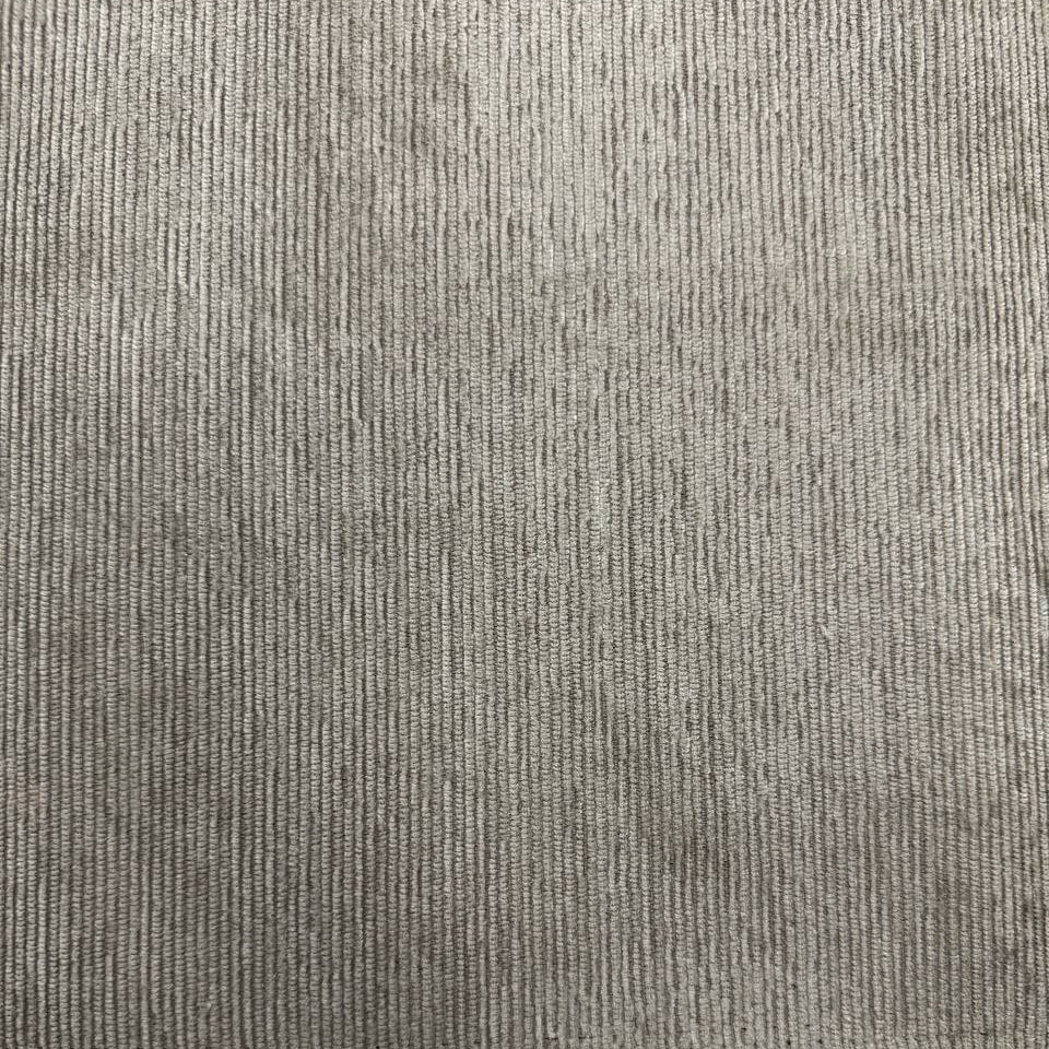 Muted sage green home décor fabric with a fine vertical ribbed texture and subtle grey undertones.