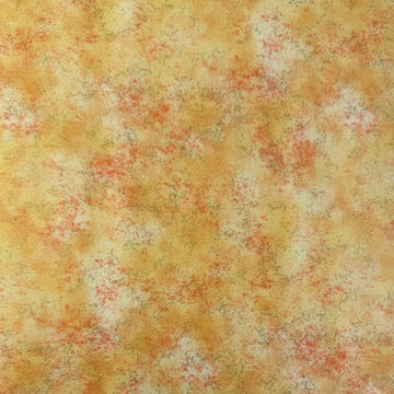 Stack of Northcott Shimmer Basics speckled quilting cotton fabrics in pastel shades with subtle metallic shimmer.