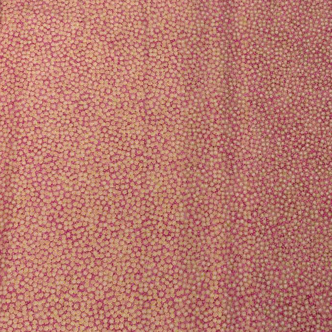 Abstract dotted fabric with a dense textured pattern and organic allover design, suitable for quilting, apparel, and craft sewing projects.