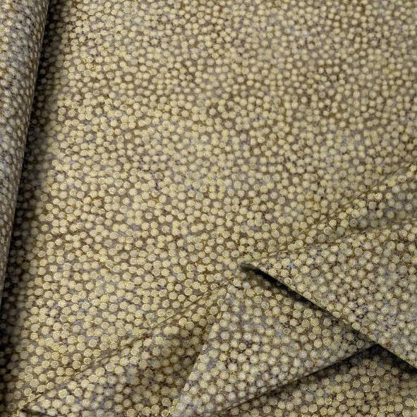 Abstract dotted fabric with a dense textured pattern and organic allover design, suitable for quilting, apparel, and craft sewing projects.