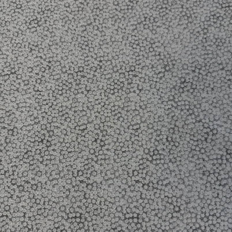 Abstract dotted fabric with a dense textured pattern and organic allover design, suitable for quilting, apparel, and craft sewing projects.