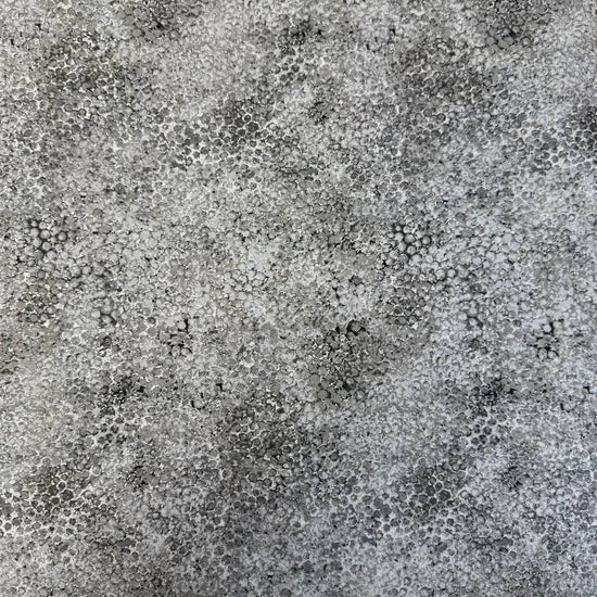 Abstract bubble texture fabric with distressed organic pattern and metallic-style detailing.