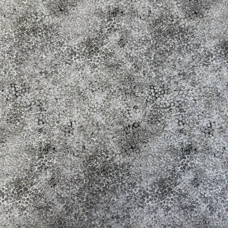 Abstract bubble texture fabric with distressed organic pattern and metallic-style detailing.