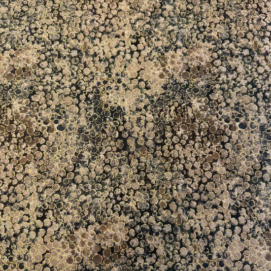 Fabric with an abstract all-over circular bubble pattern in mixed sizes and textured detailing.