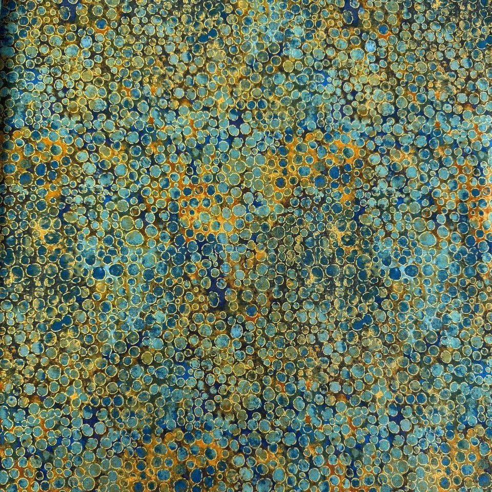 Fabric with an abstract all-over circular bubble pattern in mixed sizes and textured detailing.
