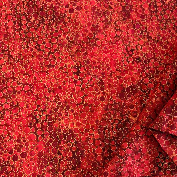 Fabric with an abstract all-over circular bubble pattern in mixed sizes and textured detailing.