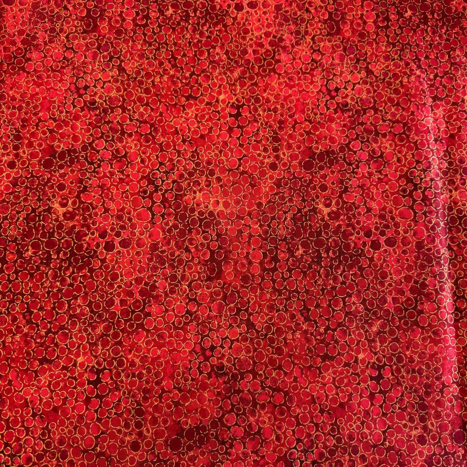 Fabric with an abstract all-over circular bubble pattern in mixed sizes and textured detailing.