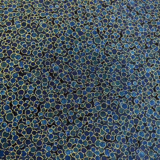 Fabric featuring an abstract all-over pattern of layered circular bubble motifs in varying sizes with a textured artistic design.