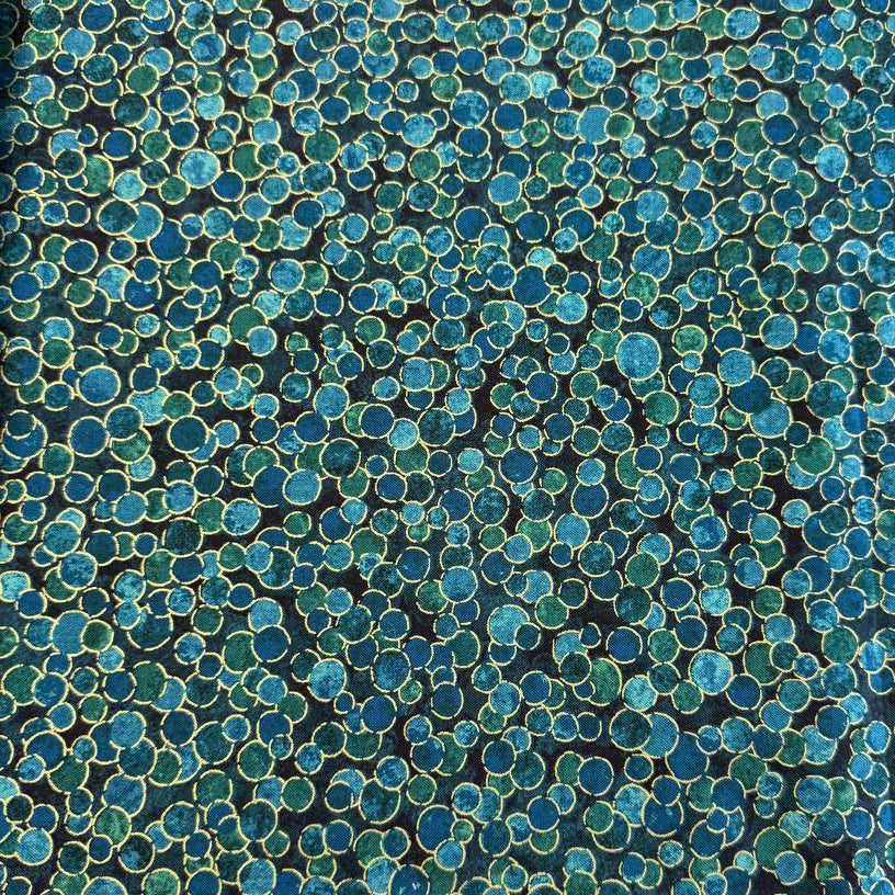 Fabric featuring an abstract all-over pattern of layered circular bubble motifs in varying sizes with a textured artistic design.