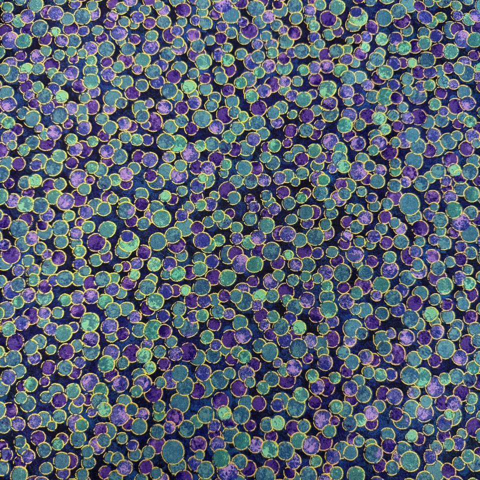 Fabric featuring an abstract all-over pattern of layered circular bubble motifs in varying sizes with a textured artistic design.