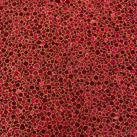 Fabric featuring an abstract all-over pattern of layered circular bubble motifs in varying sizes with a textured artistic design.
