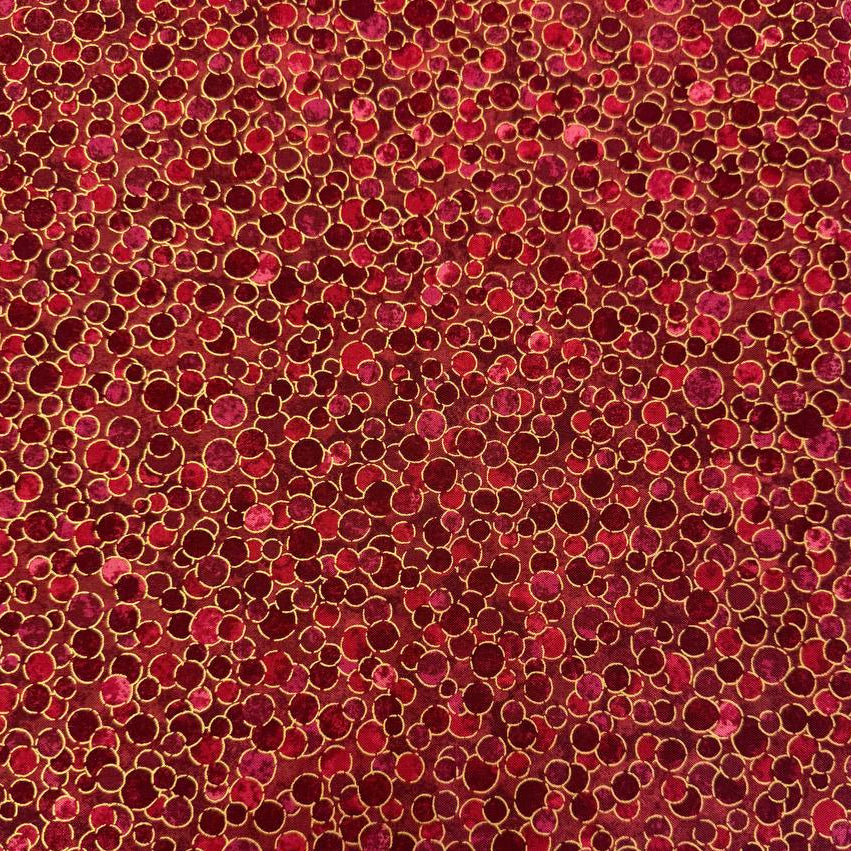 Fabric featuring an abstract all-over pattern of layered circular bubble motifs in varying sizes with a textured artistic design.