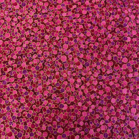 Fabric featuring an abstract all-over pattern of layered circular bubble motifs in varying sizes with a textured artistic design.