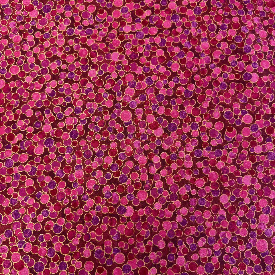 Fabric featuring an abstract all-over pattern of layered circular bubble motifs in varying sizes with a textured artistic design.