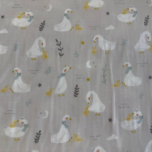 Little Ducklings double gauze fabric with duck and swan print available in two colors.