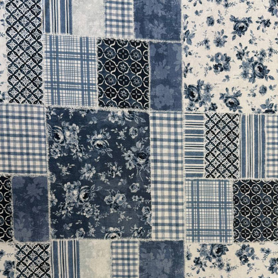 Moda Wide Essential 108 inch cotton quilt backing fabric with patchwork inspired print folded on fabric bolt display.