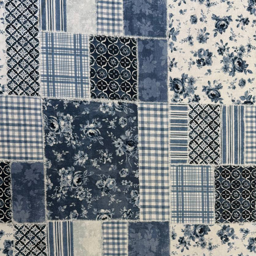 Moda Wide Essential 108 inch cotton quilt backing fabric with patchwork inspired print folded on fabric bolt display.