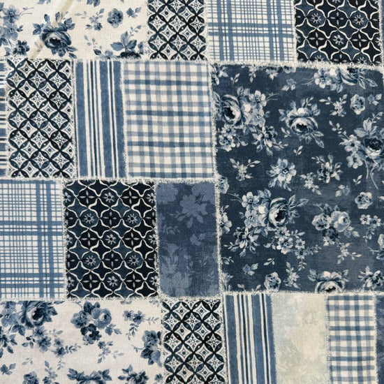 Moda Wide Essential 108 inch cotton quilt backing fabric with patchwork inspired print folded on fabric bolt display.