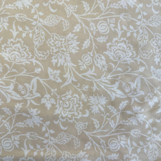Extra wide Moda Agatha Road quilt backing fabric with elegant white floral vine pattern on neutral background