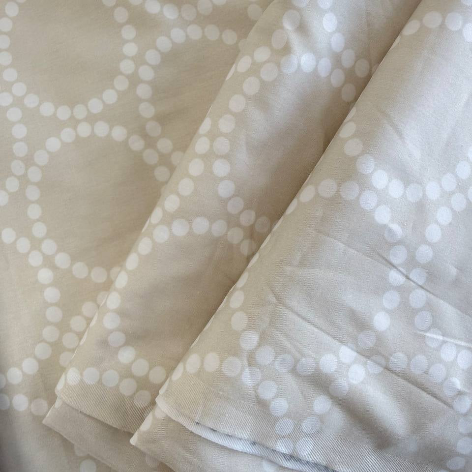Extra wide Moda Love Letter quilt backing fabric with white geometric pearl circle pattern on neutral background.