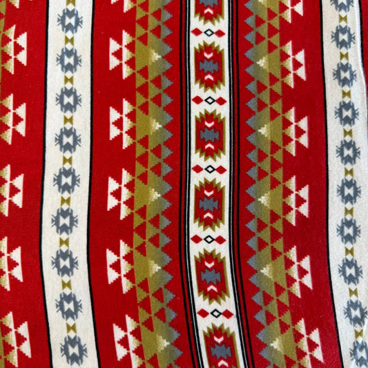 Red cotton flannelette fabric with southwestern stripe pattern in cream, gray, olive, and black tones.