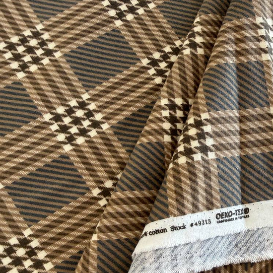 Prairie Gatherings cotton flannel fabric by Primitive Gatherings for Moda Fabrics featuring a classic plaid pattern with textured woven-style details.