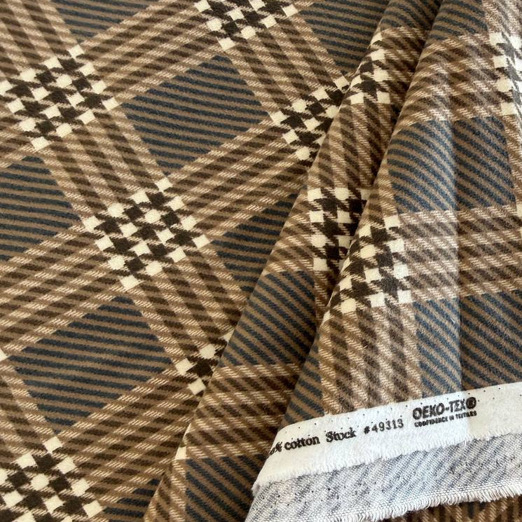 Prairie Gatherings cotton flannel fabric by Primitive Gatherings for Moda Fabrics featuring a classic plaid pattern with textured woven-style details.