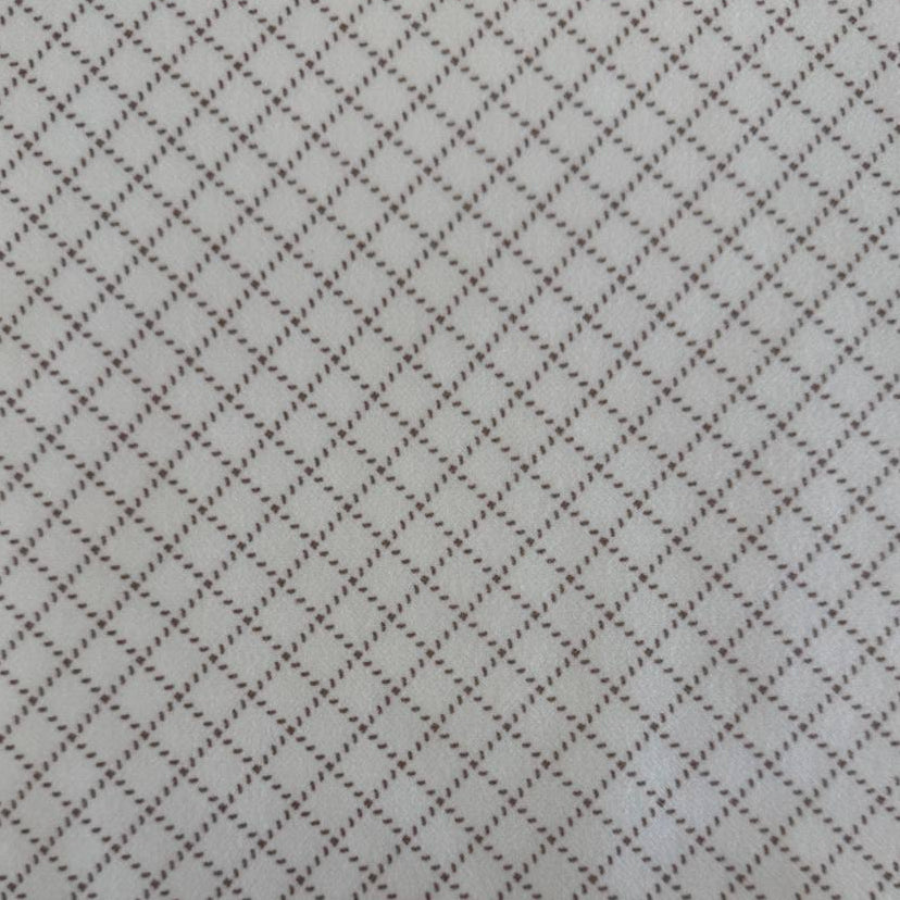 Prairie Gatherings cotton flannel fabric by Primitive Gatherings for Moda Fabrics featuring a small diamond geometric print, available in warm neutral and blue color variations.